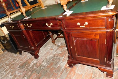 Lot 1010 - A 20thC mahogany partner's desk, the inverted...