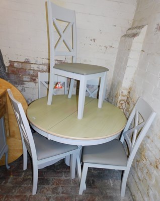 Lot 1026 - A contemporary extending circular top dining...