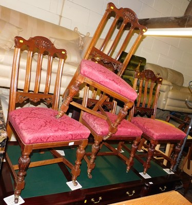 Lot 1034 - Four mahogany dining chairs, each with a...