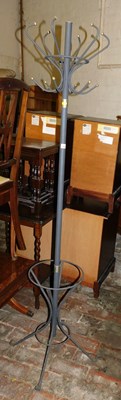 Lot 1035 - A metal coat and umbrella stand.