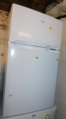 Lot 1049 - A Logik undercounter fridge freezer.