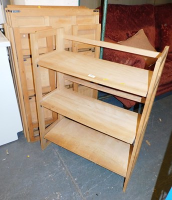 Lot 1058 - Six lightwood folding bookcases.