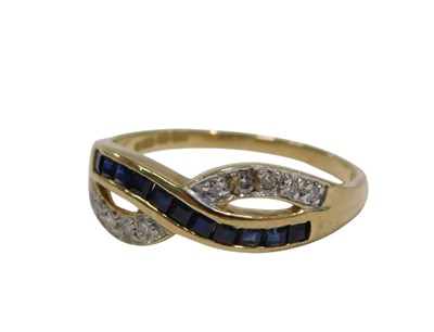 Lot 146 - A sapphire and diamond crossover ring, set...