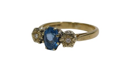 Lot 147 - A 9ct gold three stone dress ring, with...