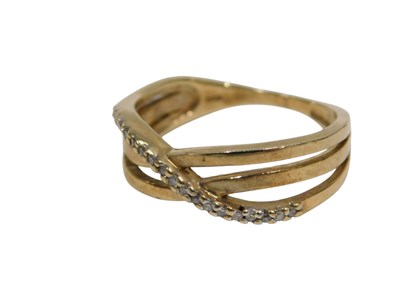 Lot 150 - A 9ct gold diamond crossover ring, of three...