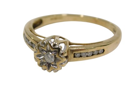 Lot 153 - A 9ct gold diamond set dress ring, the central...