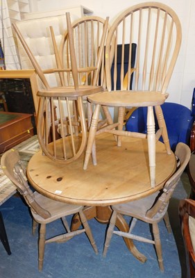 Lot 1076 - A pine circular top kitchen table, together...