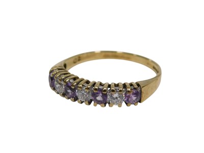 Lot 159 - A 9ct gold amethyst and CZ half hoop dress...