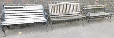 Lot 1149 - Three garden benches, each with a cast metal...