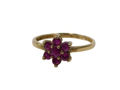 Lot 125 - A 9ct gold garnet cluster ring, set with seven...