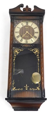 Lot 1167 - A Rhythm wall clock, with circular brass...