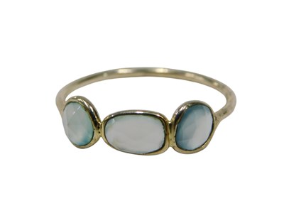 Lot 128 - An imitation moonstone three stone dress ring,...
