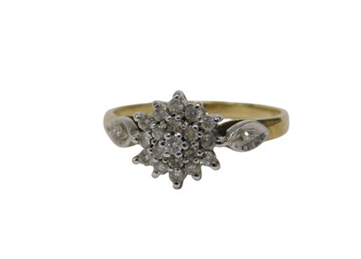 Lot 130 - A 9ct gold diamond cluster ring, the three...