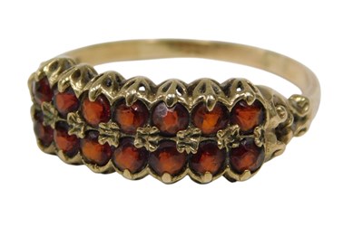 Lot 131 - A 9ct gold garnet dress ring, of two layered...