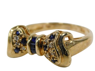Lot 132 - A 9ct gold bow dress ring, the central bow set...