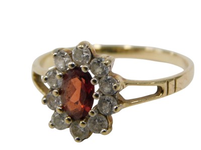 Lot 135 - A 9ct gold cluster ring, formed as a flower,...