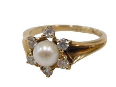 Lot 138 - A 9ct gold cluster ring, centered with a...