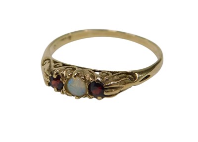 Lot 139 - A 9ct gold gypsy ring, set with central opal...
