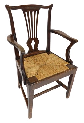 Lot 626 - A Georgian oak carver chair, with a rush seat,...