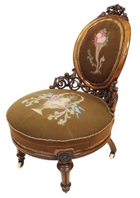 Lot 648 - A Victorian mahogany nursing chair, the oval...