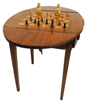 Lot 651 - A Georgian mahogany drop flap games table,...