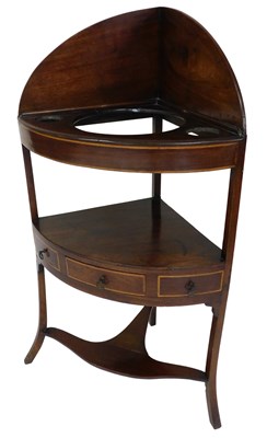 Lot 690 - A George III mahogany corner wash stand, with...