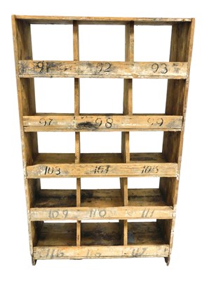 Lot 722 - An early 20thC vintage pine cubby hole...