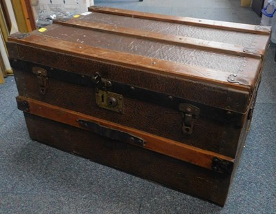 Lot 2019 - A wooden and metal travelling trunk.