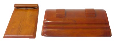 Lot 3 - An Art Deco orange Bakelite desk stand, of...