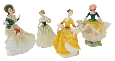 Lot 115 - Four Royal Doulton porcelain figures, modelled...