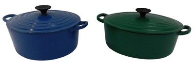 Lot 184 - A Le Creuset green cast iron twin handled...