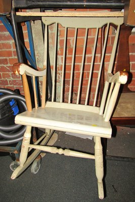 Lot 1015 - A grey painted rocking chair, with spindle...