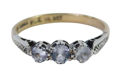 Lot 372 - A three stone dress ring, set with three round...