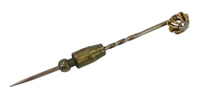 Lot 371 - A diamond set stick pin, set with an old cut...