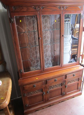 Lot 1076 - A large oak dresser, with glazed and leaded...