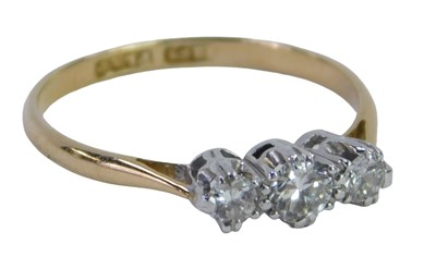 Lot 364 - A three stone diamond dress ring, set with...