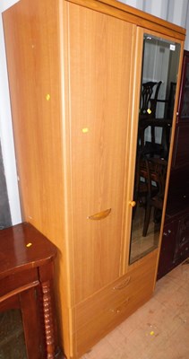 Lot 1078 - A modern wood effect two-door wardrobe, mirror...
