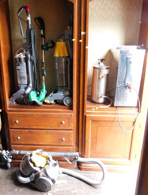 Lot 1093 - A Dyson upright vacuum cleaner, together with...