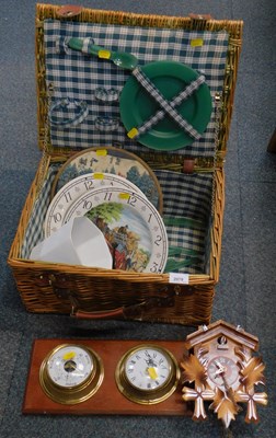 Lot 2079 - A picnic hamper with picnic items, a barometer,...