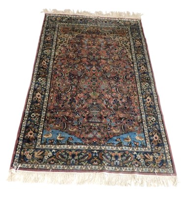 Lot 744 - A Kashan pink ground prayer rug, the mihrab...
