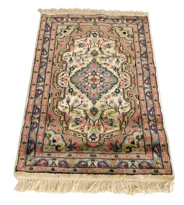 Lot 422 - A Tabriz cream ground prayer rug, the central...