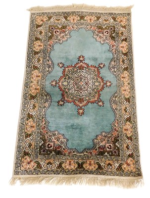 Lot 752 - A Caucasian turquoise ground rug, with a large...