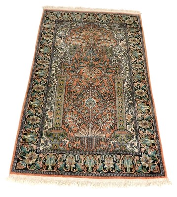 Lot 746 - A Kashmiri red ground tree of life prayer rug,...