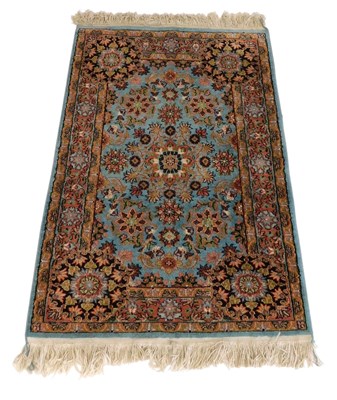 Lot 747 - A Tabriz turquoise ground rug, the central...