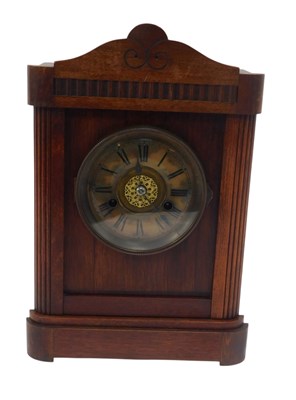 Lot 247 - A late Victorian oak cased mantel clock, the...