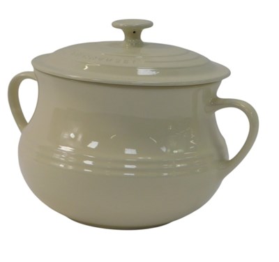 Lot 248 - A Le Creuset cream ceramic twin handled...