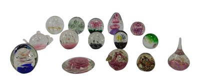Lot 254 - A group of glass paperweights, to include...