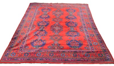 Lot 743 - A red ground rug, 363cm x 319cm.