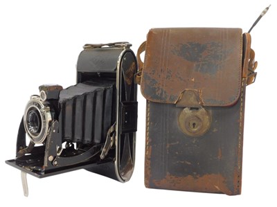Lot 497 - An Agfa folding camera, in a leather case.