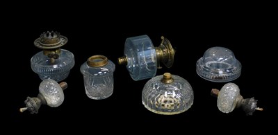 Lot 517 - Seven Victorian and later clear glass oil lamp...